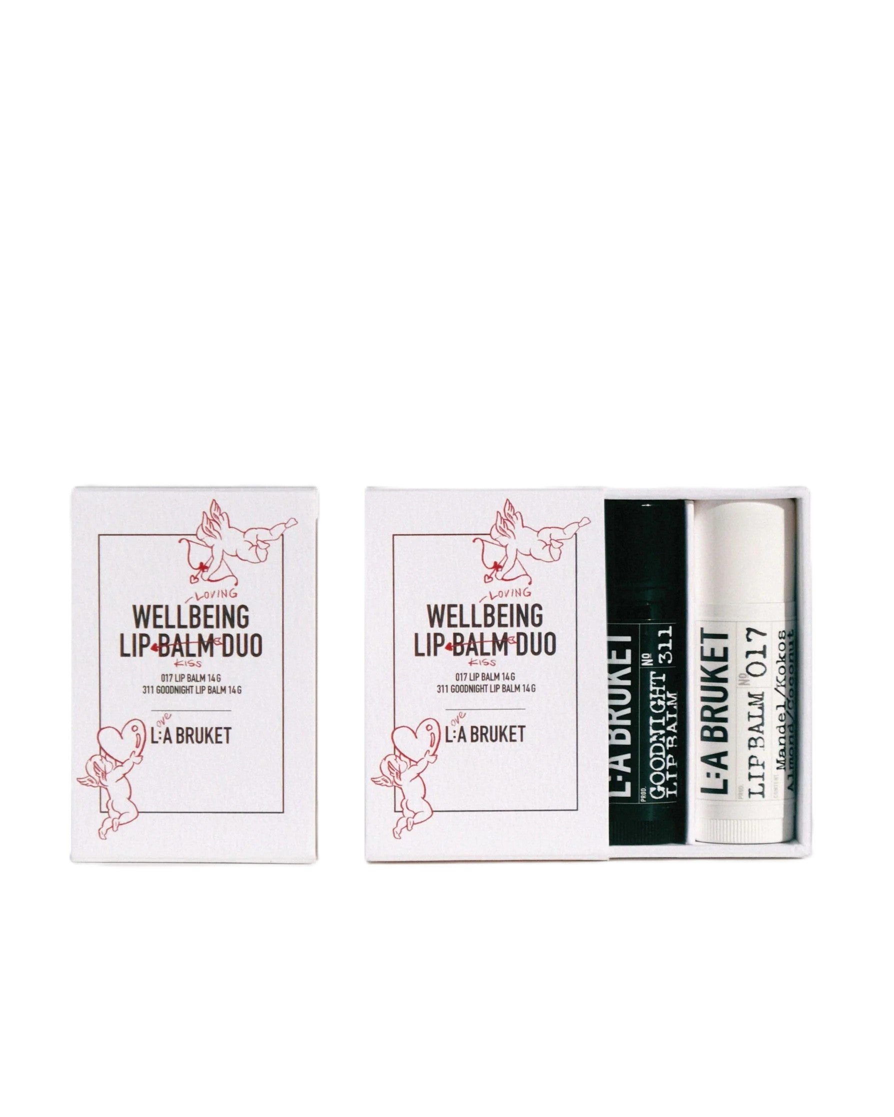L:A BRUKET Wellbeing Lip Balm Duo Kiss – weiße Kartonbox mit zwei Stiften, 14g, weißem und schwarzem Gehäuse – Lippenpflege