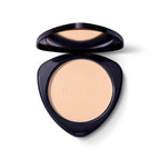Dr. Hauschka Compact Powder 00 Translucent – schwarzes Puderdöschen, cremefarbener Puder, weißer Hintergrund – Make-up