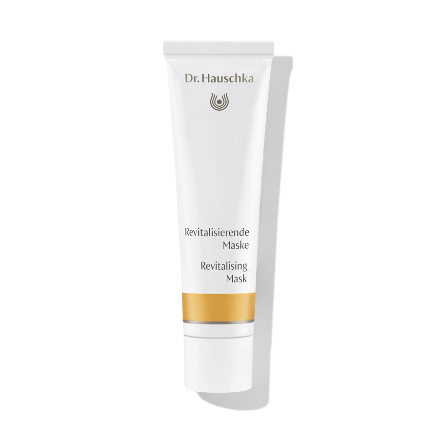 Dr. Hauschka Revitalisierende Maske – weiße Tube mit goldener Linie, weißem Deckel, weißem Hintergrund – Hautpflege