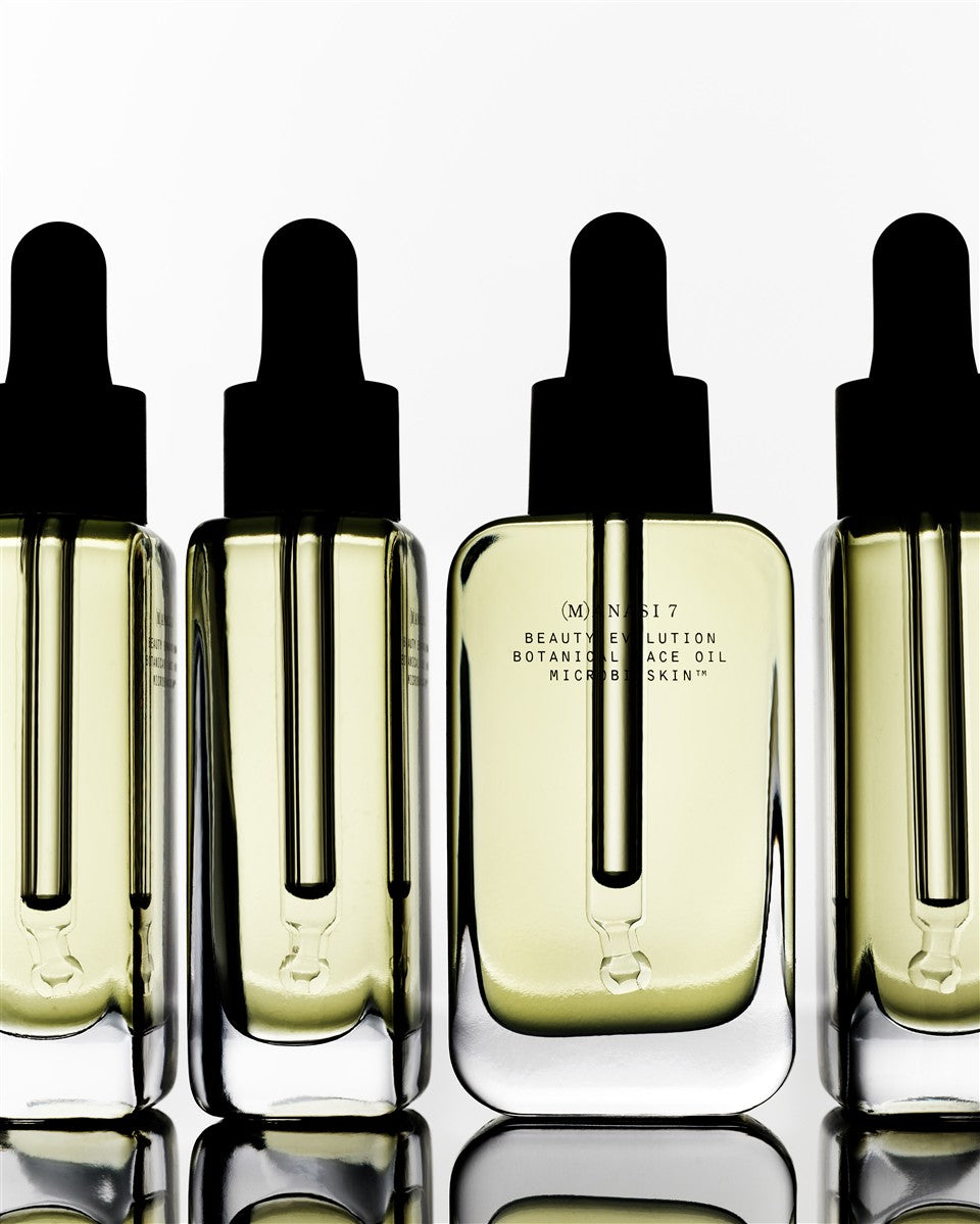 Botanical Face Oil Armonia – clear glass bottle with black dropper cap, creamy liquid, white background – skin care