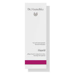 Dr. Hauschka Haaröl – weißes Kartonpaket mit lila Streifen, Dosierspender, weißer Hintergrund – Haarpflege