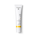Dr. Hauschka Getönte Sonnencreme LSF 30 – weiße Tube mit weißem Deckel, gelber Akzentstreifen, weißem Hintergrund – Gesichtspflege