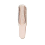 Hairbrush – soft pink plastic with rose gold bristles, white background – hair care