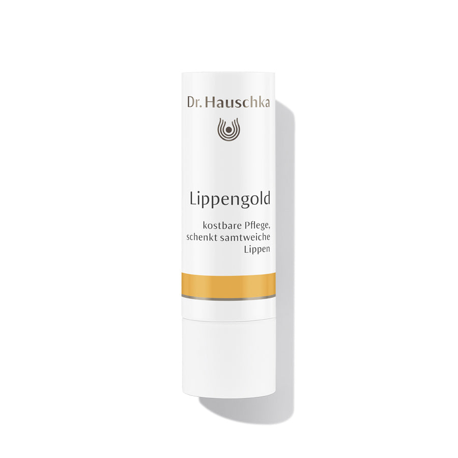 Dr. Hauschka Lippengold – weißer Lippenstift-Tube mit goldener Linie, weißem Hintergrund – Lippenpflege