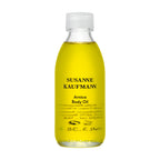 Susanne Kaufmann Arnica Body Oil in a glass bottle with white screw cap on white background, skin care
