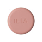 Pink round jar of ILIA Soft Focus Blurring Blush on white background, makeup