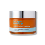 The Organic Pharmacy Carrot Butter Cleanser in an jar with a silver lid on white background, skin care