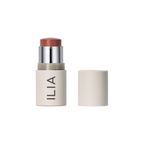 ILIA Multi-stick in beige tube with cap on white background, makeup
