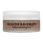 Susanne Kaufmann Refining Scalp & Body Scrub in a glass jar with a white screw cap for skin care