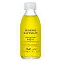 Susanne Kaufmann Pomegranate Body Oil in a transparent bottle with a white screw cap, skin care