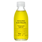 Susanne Kaufmann Pomegranate Body Oil in a transparent bottle with a white screw cap, skin care
