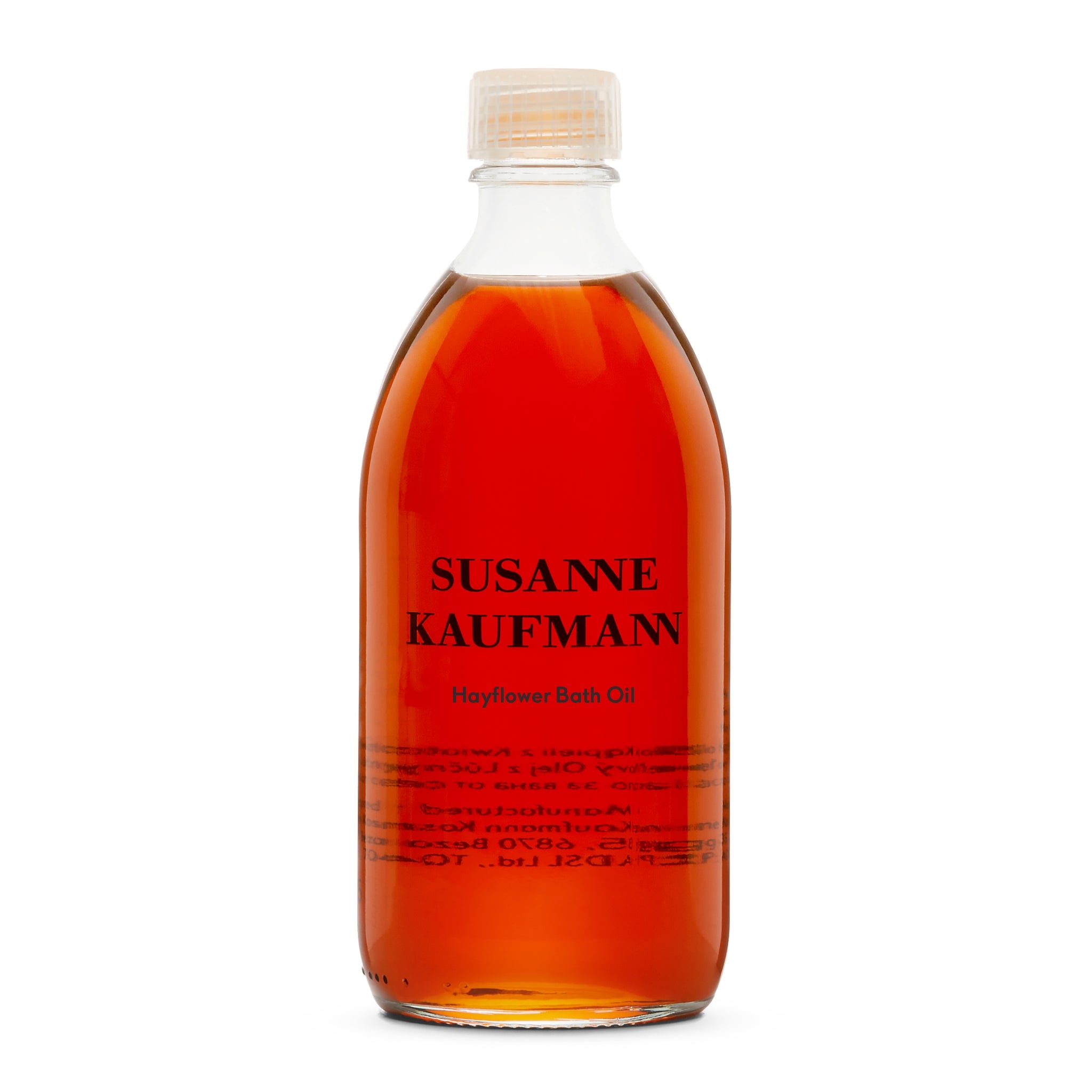 Susanne Kaufmann Hayflower Bath Oil in einer durchsichtigen Glasflasche mit weißem Schraubverschluss, Körperpflege