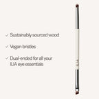 ILIA Angled Line + Smudge Brush with white wooden handle on light background, vegan eye makeup tool.