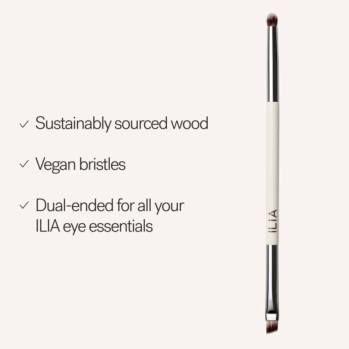 ILIA Angled Line + Smudge Brush with white wooden handle on light background, vegan eye makeup tool.