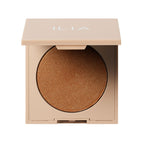 ILIA Daylite Highlighting Powder Showdown in a beige compact case on a white background, highlighter