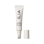 White tube of ILIA Lip Wrap Reviving Balm with white cap on white background, lip care.