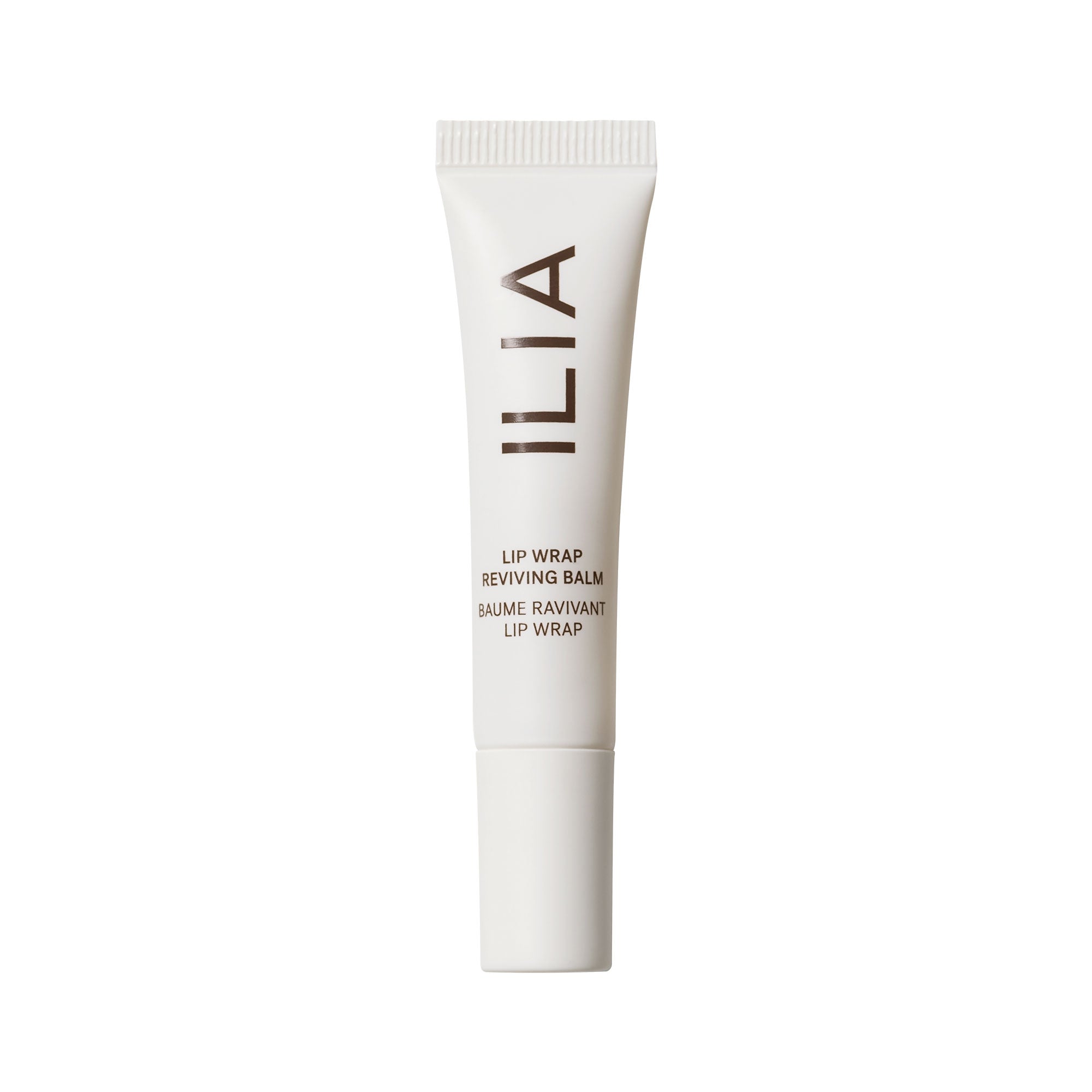 White tube of ILIA Lip Wrap Reviving Balm with white cap on white background, lip care.
