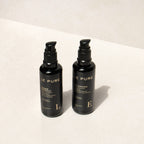 Le Pure E&l the Eye Set: zwei schwarze Flaschen mit Pumpaufsatz auf hellem Hintergrund, Augenpflege.