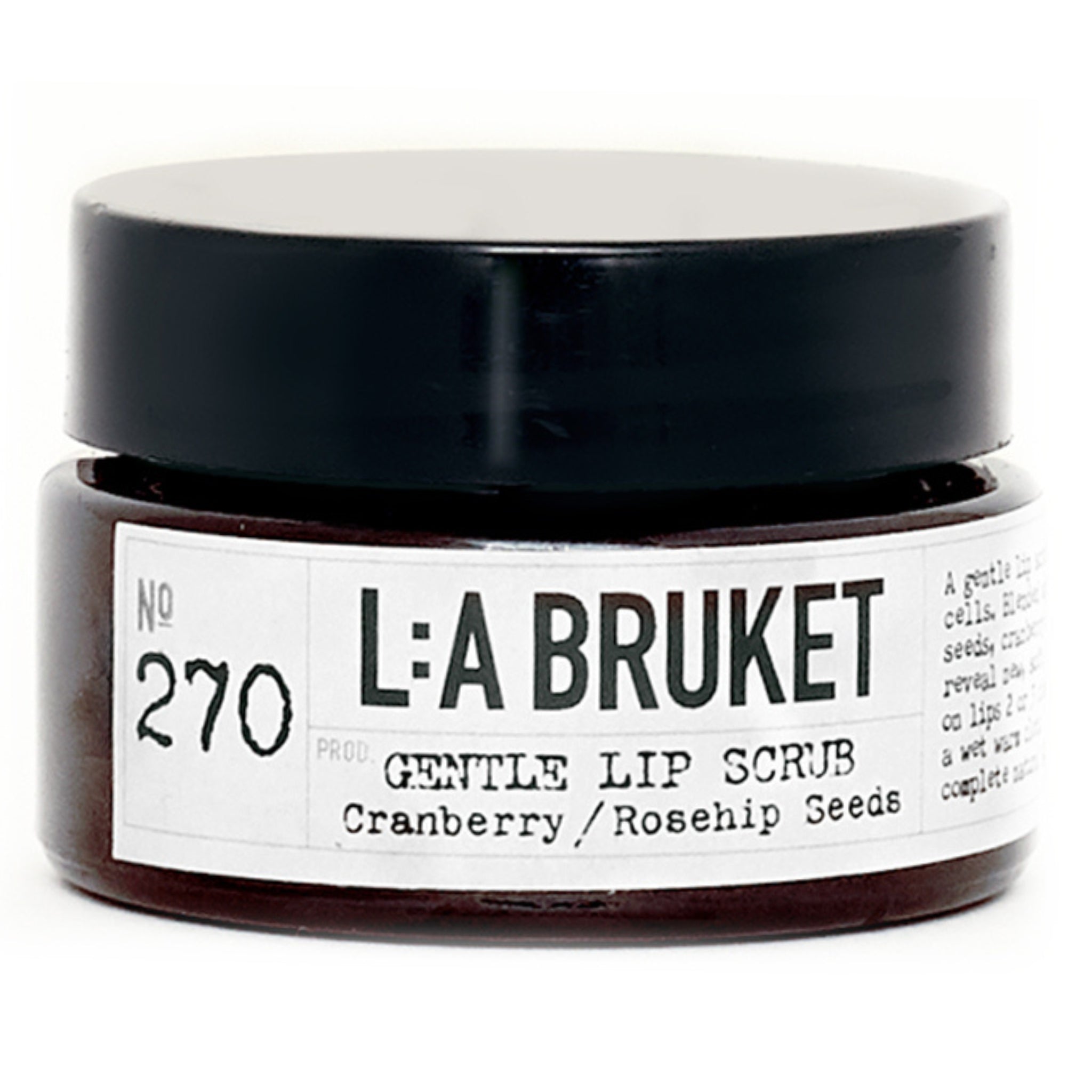 L:A Bruket No. 270 Gentle Lip Scrub in a dark glass jar with a black lid on a white background, lip care