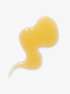 Yellow drop of Face Oil on a white background for skin care