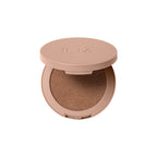ILIA Sunshift Cream Bronzer in a brown compact jar on a white background, makeup