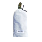 Soopz Le Palmier, white fabric pouch with patterned closure and logo label.