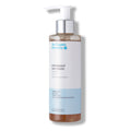 The Organic Pharmacy Peppermint Face Wash in a bottle with pump on white background, skin care