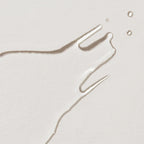 Nourishing facial toner texture as a transparent drop on a light background, skin care mood