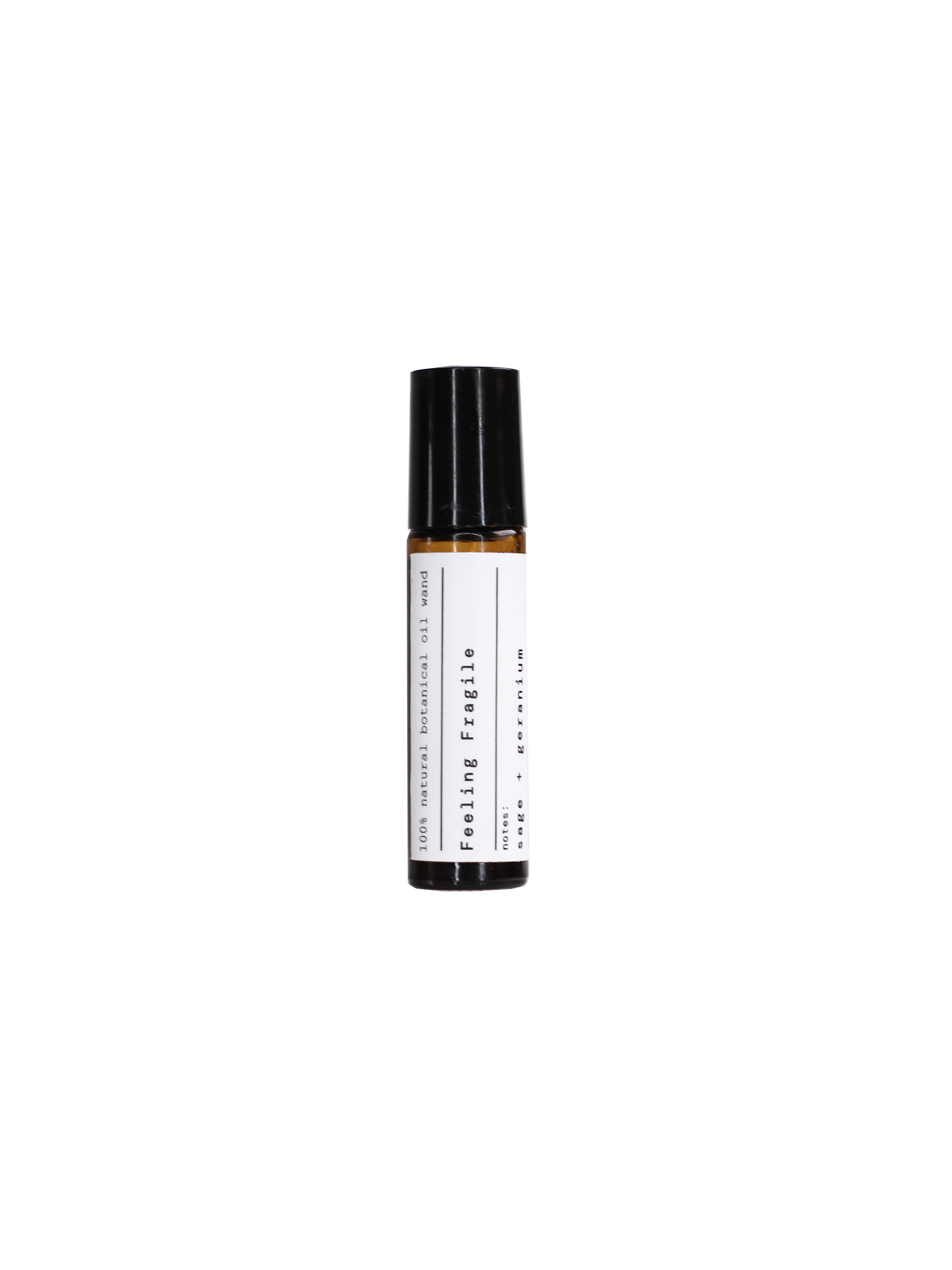 Feeling Fragile essential oil in a brown glass bottle with a black cap on a black background, skin care.