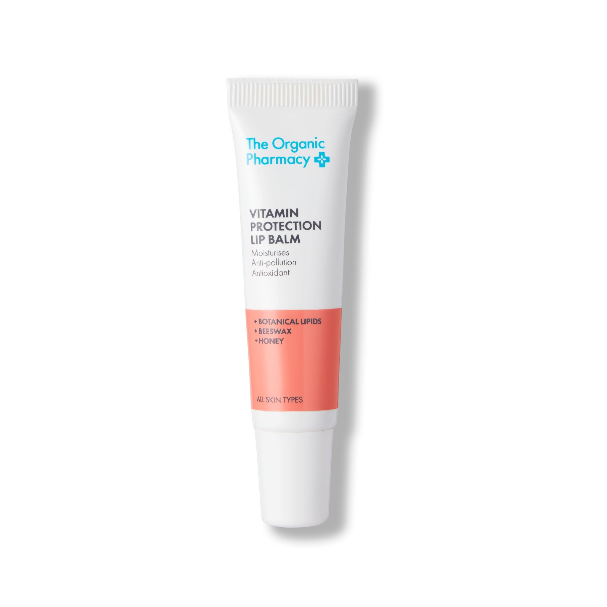 The Organic Pharmacy Vitamin Protection Lip Balm in einer Tube mit weißem Deckel auf weißem Hintergrund, Lippenpflege