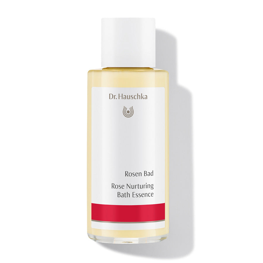 Dr. Hauschka Rosen Bad – durchsichtige Flasche mit weißem Deckel, rotem Streifen, weißem Hintergrund – Badeessenz