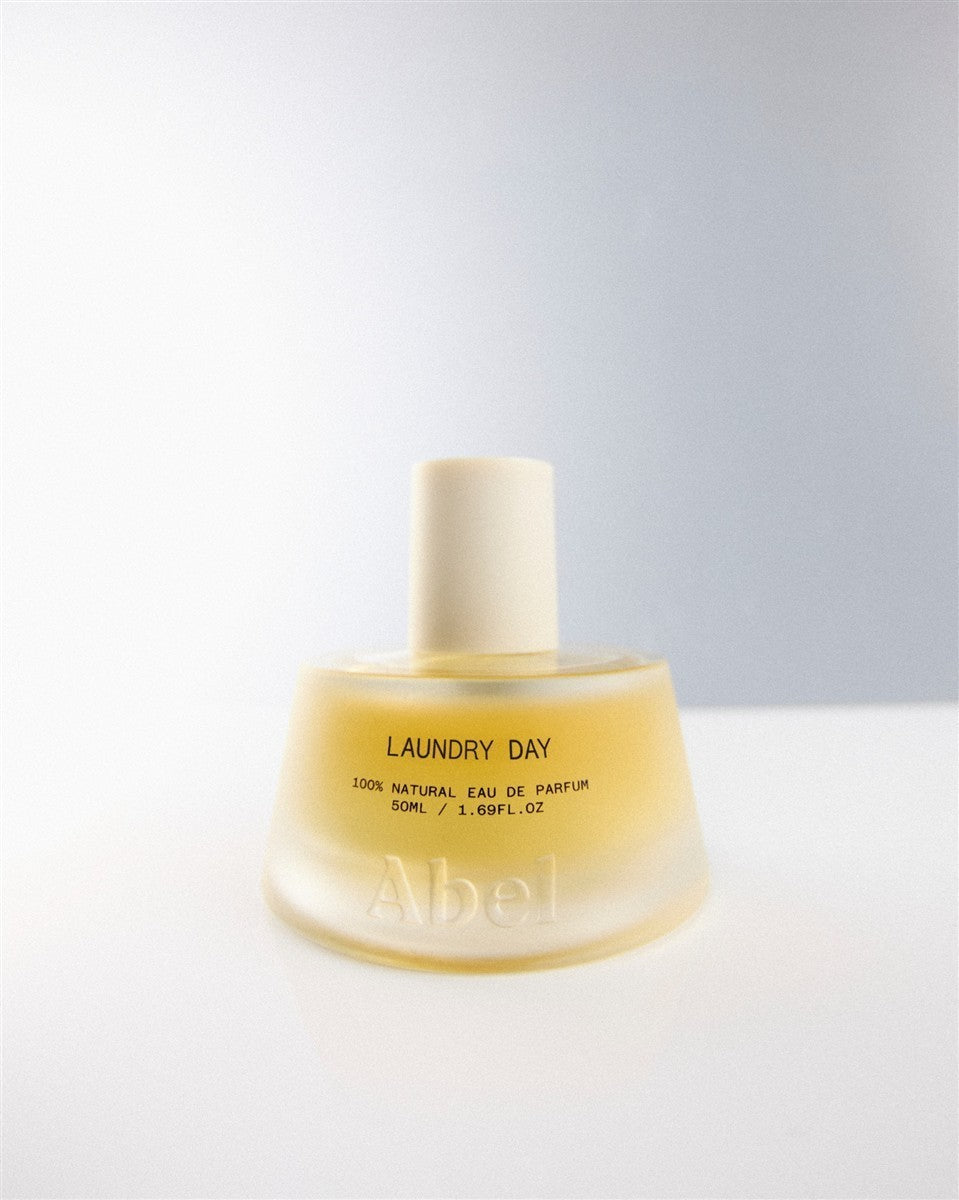 Abel Laundry Day Perfume – yellow glass bottle 50ml, cream cap, white background – perfume