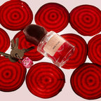 Red Flag Eau de Parfum – clear glass bottle with brown velvet cap, red background – perfume