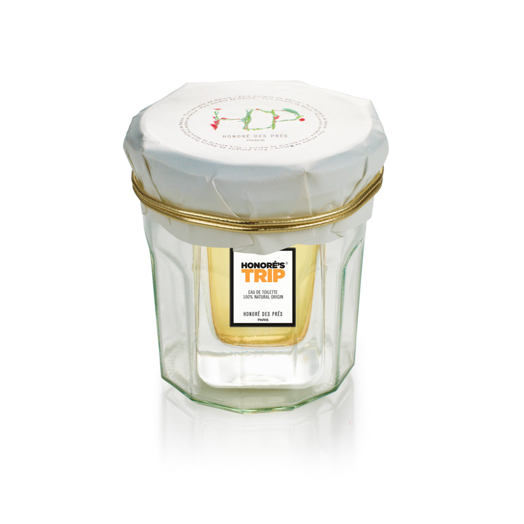 Honoré's Trip Eau de Toilette – klares Glasfläschchen mit weißem Deckel, goldener Kante, weißem Hintergrund – Parfüm