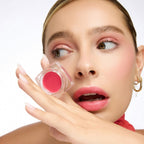 Le Baume Teinté Lips – durchsichtige quadratische Dose mit rosafarbenem Balsam, weißer Hintergrund – Lippenpflege