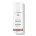 Dr. Hauschka Regeneration Handbalsam – weißer Tube mit braunem Band, weißem Hintergrund – Handpflege