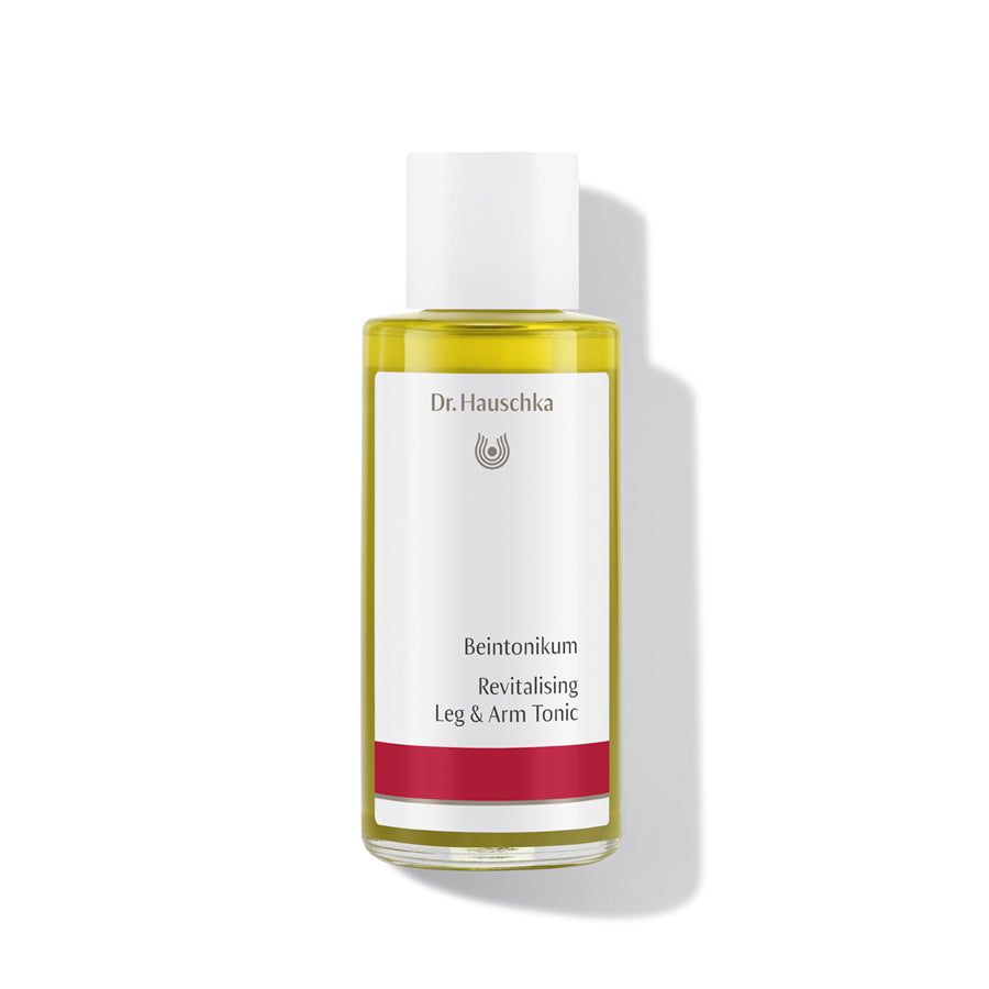 Dr. Hauschka Beintonikum – durchsichtige Glasflasche mit weißem Deckel, weißer Hintergrund – Beinpflege