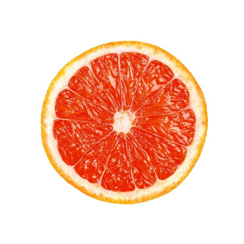 Zitrus-Scheibe für Luxus-Handcreme – frische Grapefruit auf weißem Hintergrund – Hautpflege
