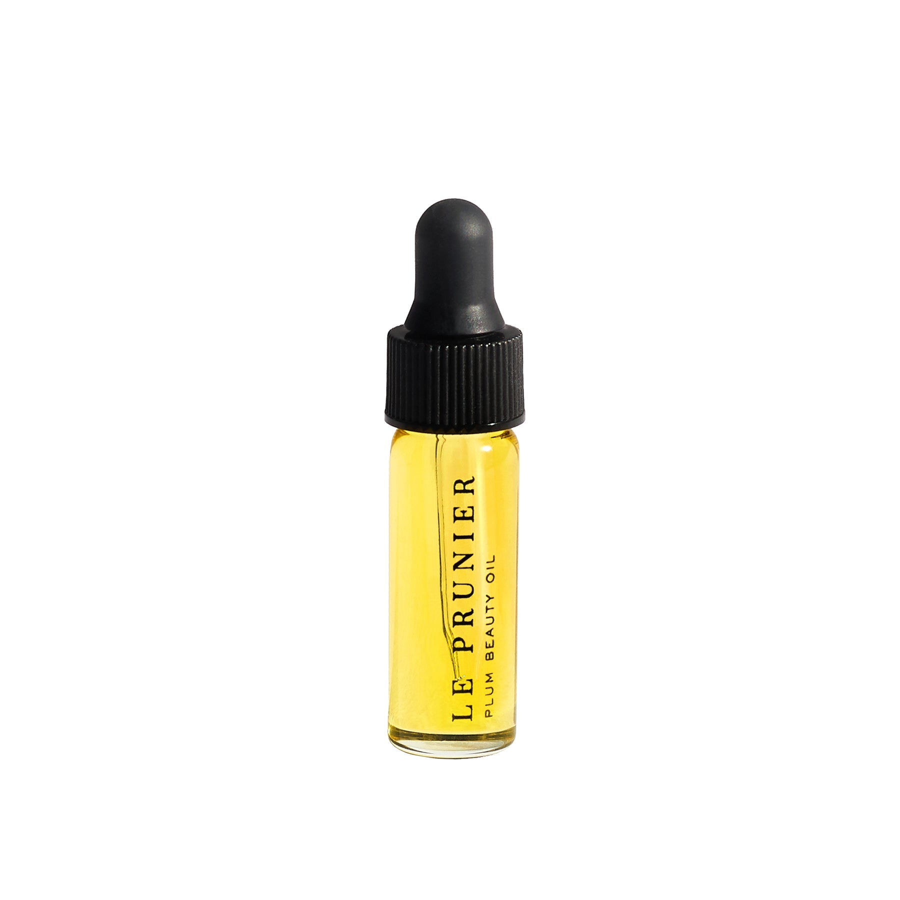 Le Prunier Plum Beauty Oil – clear glass bottle with black dropper cap, yellow oil, white background – skin care