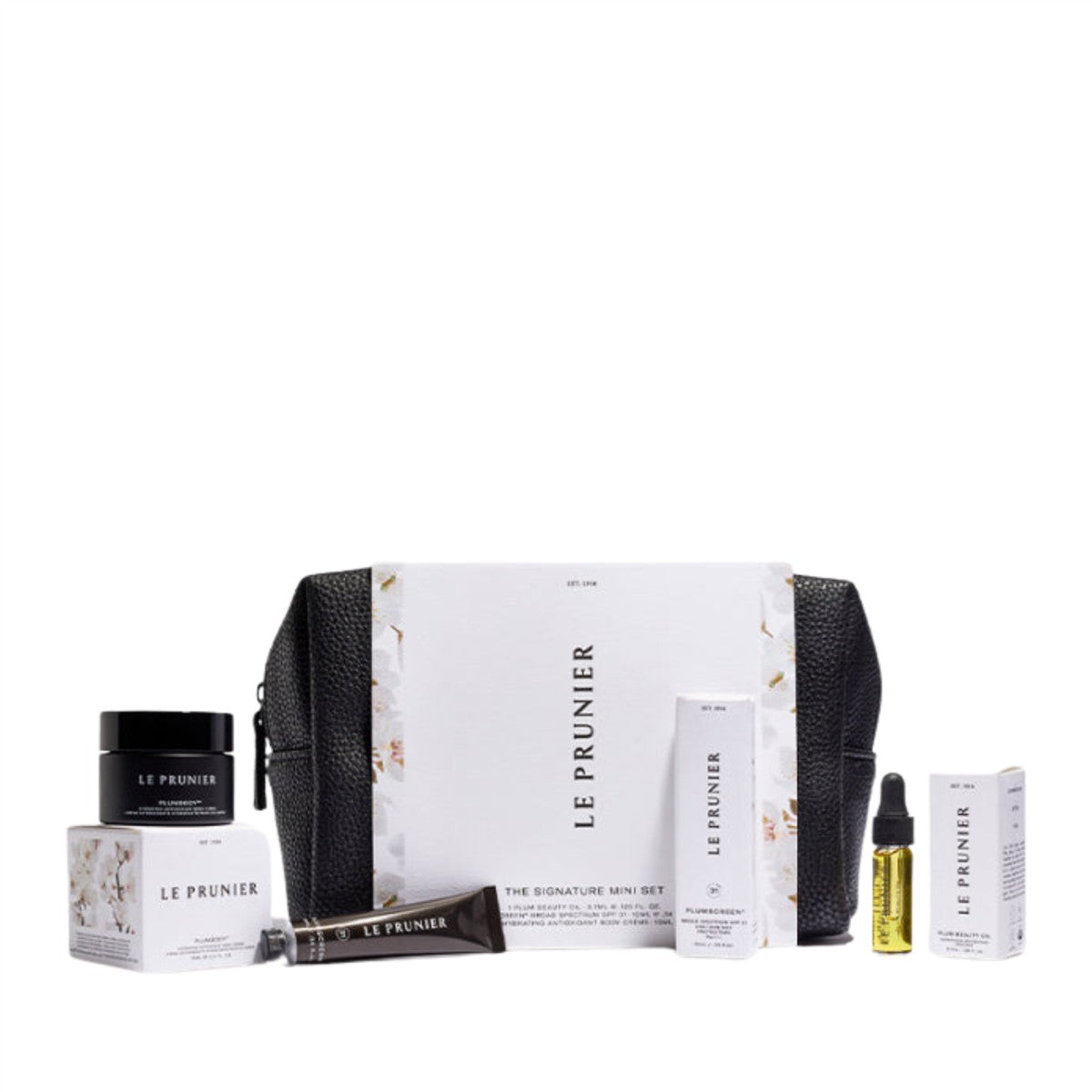 Le Prunier Signature Mini Set – weiße Verpackung mit schwarzer Tasche, verschiedene Mini-Produkte, weißer Hintergrund – Hautpflege