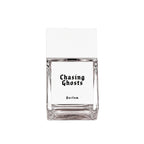 Chasing Ghosts Parfum – clear glass bottle with white label and cap, white background – perfume