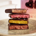 Nut Butter Chocolate – four flavors, chocolate coating, on ceramic plate – snack