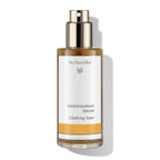 Dr. Hauschka Gesichtstonikum klärend – braune Glasflasche mit Sprühkopf, weißem Etikett und orangefarbenem Streifen – Hautpflege