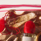 Sel À Vie Eau de Parfum – 20ml ampoule, clear with red cord, sand background – perfume