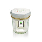 Nu Green Eau de Toilette – klares Glasfläschchen mit weißem Deckel und goldener Kordel, weißer Hintergrund – Parfüm
