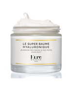 Kure Bazaar Le Super Baume Hyaluronique – clear glass jar, white cream, gold accents, white background – skin care