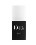Kure Bazaar Studio Top Coat Haute Résistance – schwarze Flasche mit weißem Deckel, weißer Hintergrund – Nagelpflege