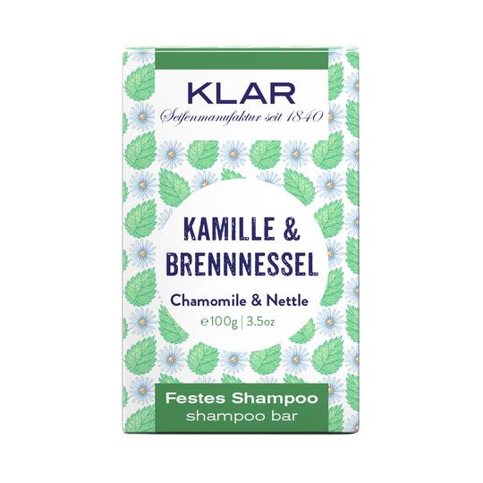 KLAR Festes Shampoo Kamille & Brennnessel, 100g, grün-weiße Verpackung mit Blättern und Blüten – Haarpflege