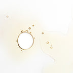 The Toner – golden liquid droplets on white background, minimalist aesthetic – skin care