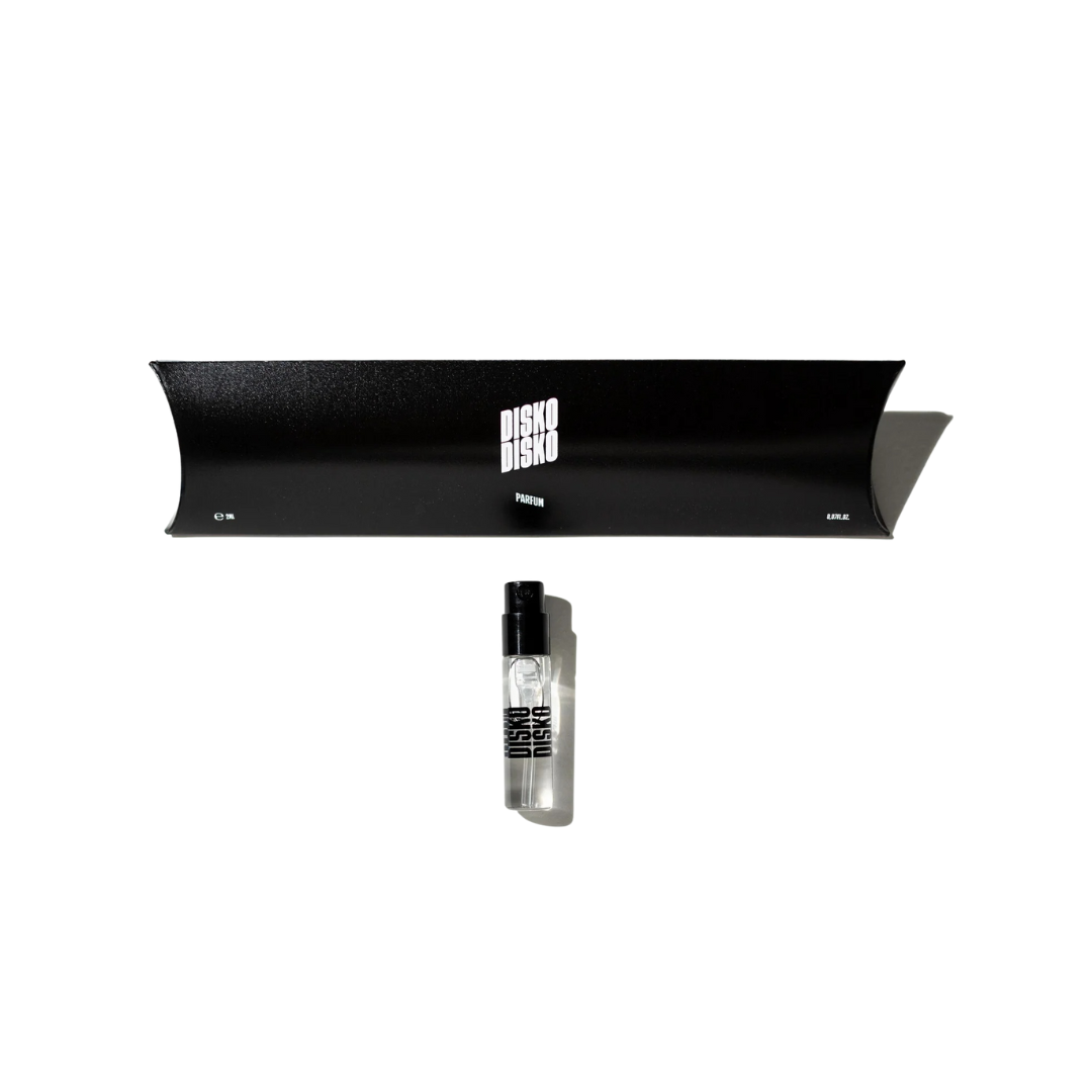 Disko Disko Parfum – 2ml Sprayflakon mit schwarzem Verschluss, schwarze Verpackung, weißer Hintergrund – Parfüm
